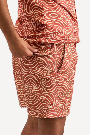 Kali Swim Shorts: Men - Orange Wave Print