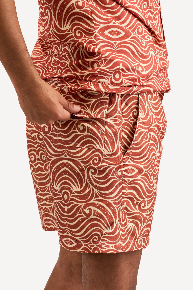 Kali Swim Shorts: Men - Orange Wave Print