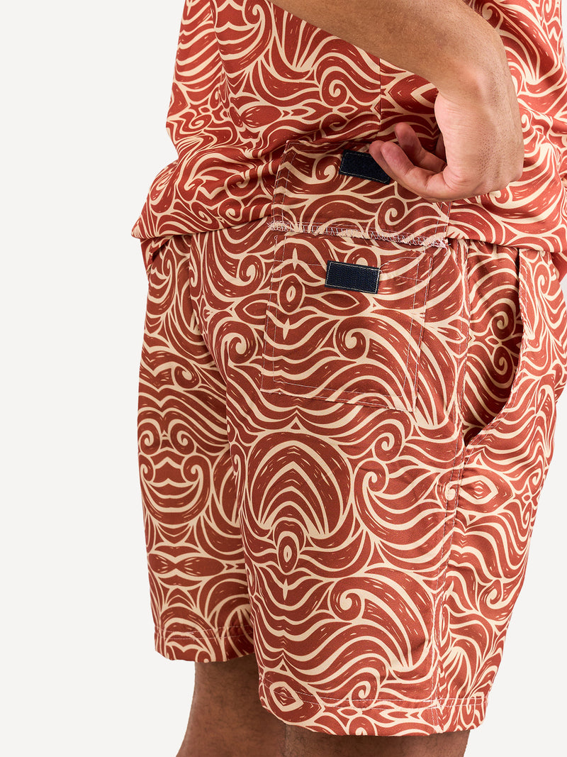 Kali Swim Shorts: Men - Orange Wave Print